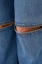 بنطال جينز بحافة واسعة وفتحات